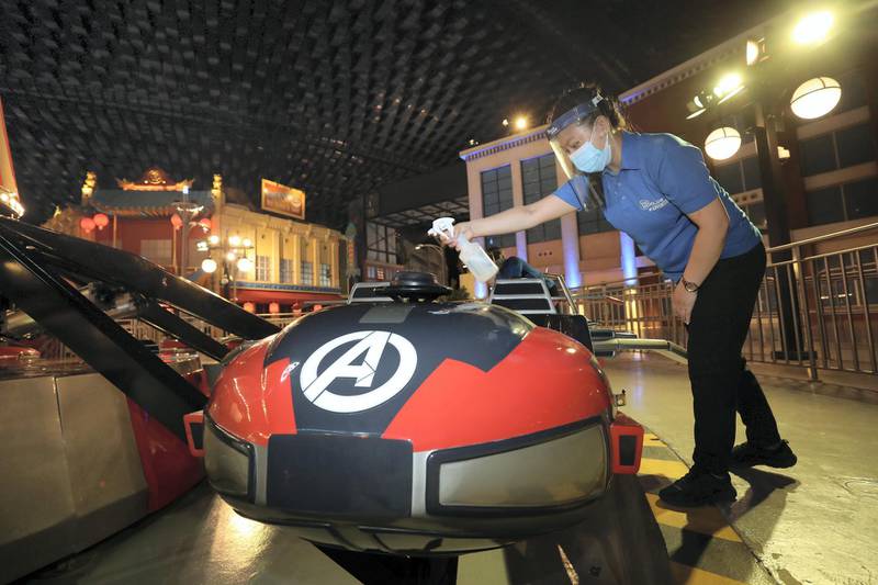 Dubai, United Arab Emirates - Reporter: N/A. Covid-19/Coronavirus. Sangeeta cleans the Flight of the Quinjets ride after people have been on it. IMG World of Adventure opened on recently to the public with strict Covid-19/Coronavirus safety measures. Tuesday, July 21st, 2020. Dubai. Chris Whiteoak / The National
