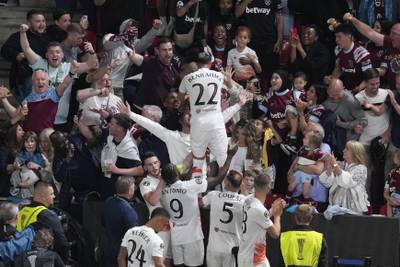 West Ham's Said Benrahma celebrates with teammates and fans after scoring his side's opener from the penalty spot. AP 