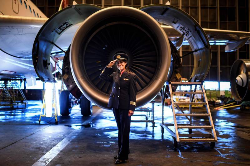 To mark International Women's Day, this is a series of photos depicting women performing roles or working in professions more traditionally held by men. In this picture, Ana Sousa, 45, TAP Air Portugal pilot for 11 years, poses for a portrait at a TAP hangar in Lisbon. Patricia De Melo Moreira / AFP Photo