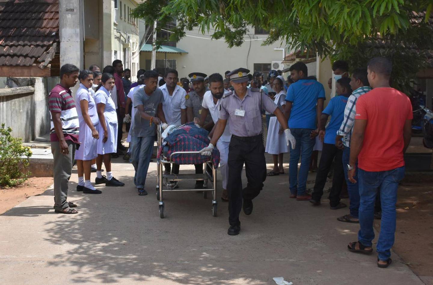 epa07518954 One of the blast victim is brought to a hospital in Colombo, Sri Lanka, 21 April 2019. According to the news reports at least 138 people killed and over 400 injured in a series of blasts during the Easter Sunday service at St Anthony's Church in Kochchikade, Shangri-La Hotel and Kingsbury Hotel with many more places.  EPA/M.A. PUSHPA KUMARA