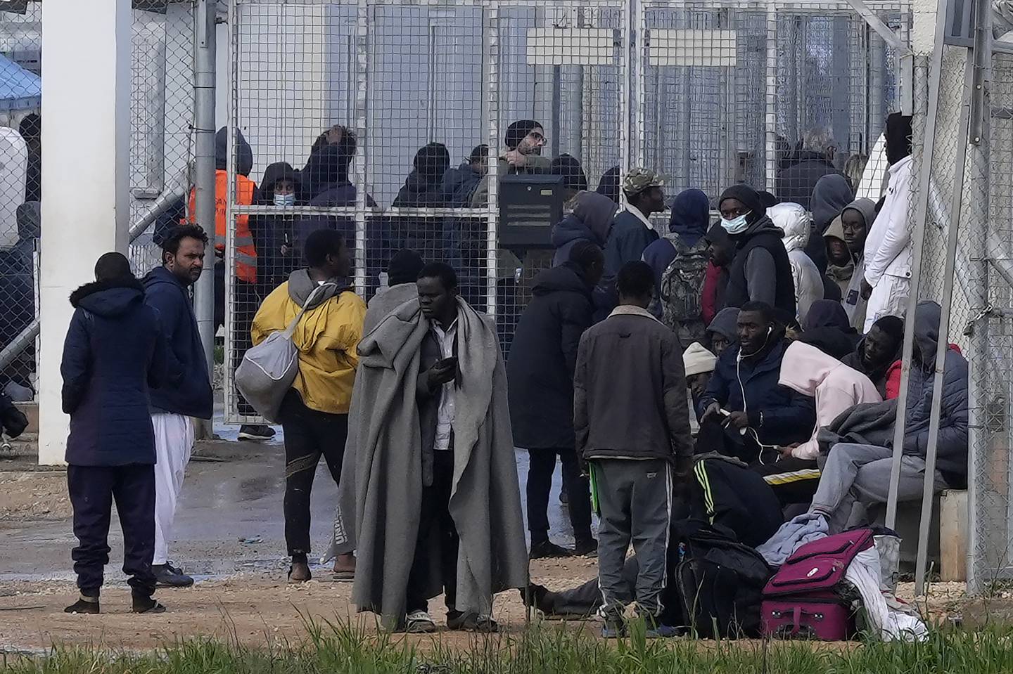 Migrants outside Pournara reception centre in February. AP