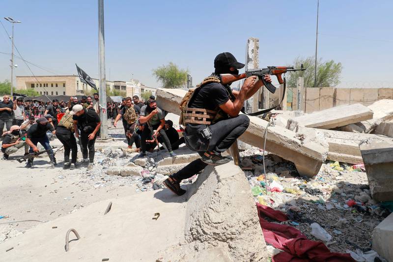 A member of Saraya Al Salam takes aim. AFP