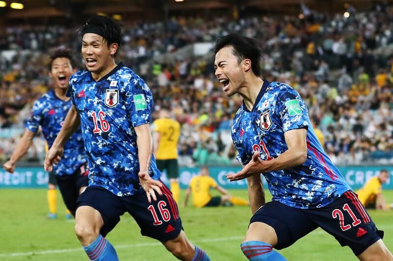 Japan's Kaoru Mitoma celebrates after scoring against Australia in the World Cup qualifier at Accor Stadium in Sydney, on March 24, 2022. Japan qualified for the finals in Qatar after the 2-0 victory. Getty