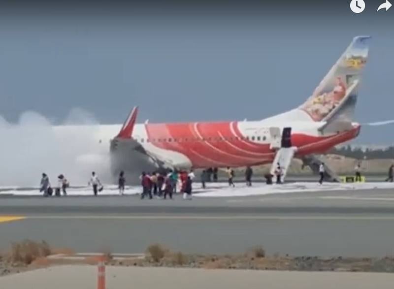 Witness footage showed passengers using emergency slides and running across the tarmac. Photo: 'Times of Oman'