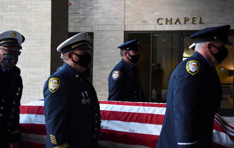 Members of the Houston Fire Department carry the casket of Jerry Pacheco, a firefighter who died of coronavirus, at a memorial service in Houston, Texas, US. Reuters