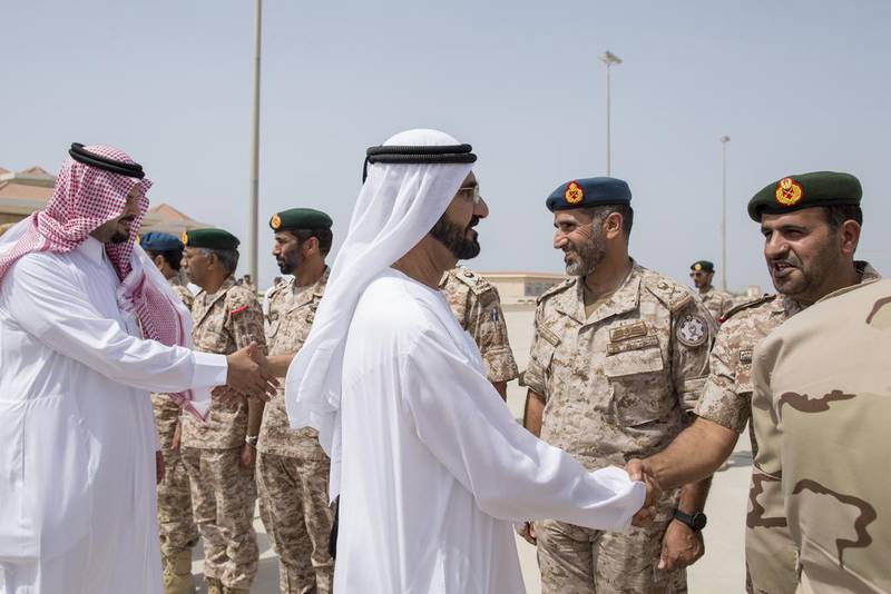 Sheikh Mohammed and Prince Salman bin Sultan, Saudi Arabia's Deputy Minister of Defence, greet military personnel who took part in a joint UAE-Egypt military exercise in Al Gharbia in March 2014. Photo: Crown Prince Court - Abu Dhabi