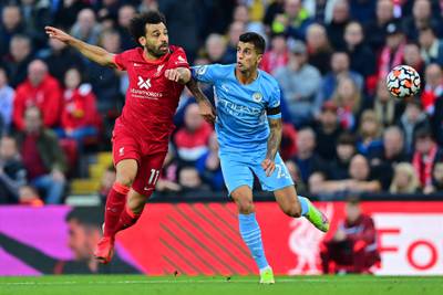 Liverpool's Mohamed Salah challenges Manchester City's Rodrigo. AFP