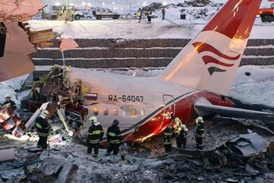 Rescuers working at the crash site of the Tupolev -204 aircrash at Vnukovo airport in Moscow, Russia.  EPA / Ministry of the Emergencies press service