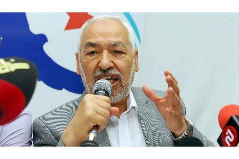 Rached Ghannouchi announces Ennahda's departure from the political reform commission yesterday in Tunis. Fethi Belaid / AFP