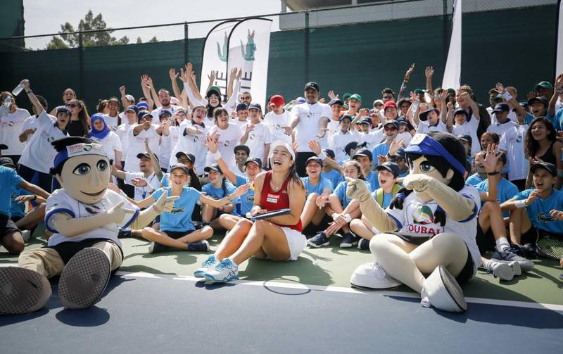 Latisha Chan with mascots Ace and Annette at the Lacoste Special Needs Clinic