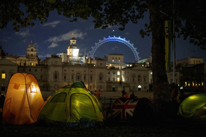 People in London camp during the night before the funeral of Queen Elizabeth II. Reuters
