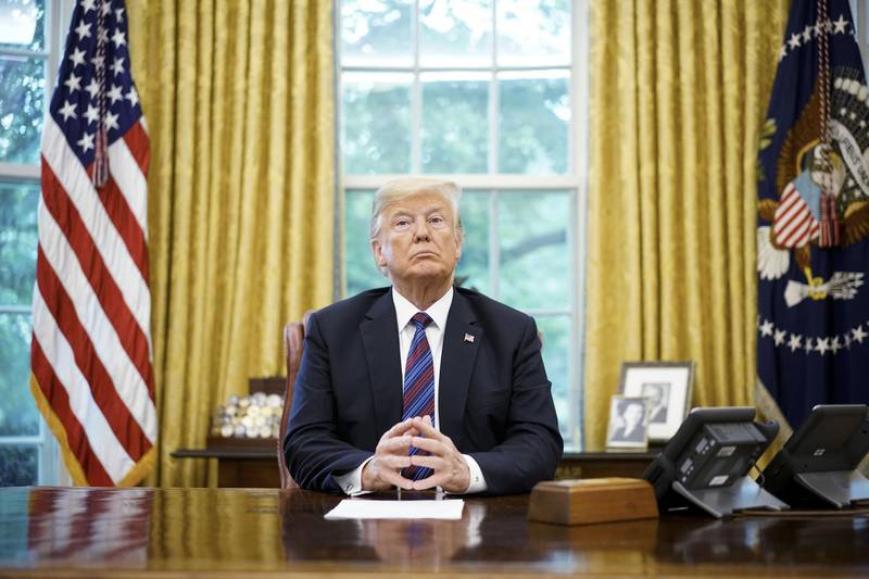 (FILES) In this file photo taken on August 27, 2018, US President Donald Trump listens during a phone conversation with Mexico's President Enrique Pena Nieto on trade in the Oval Office of the White House in Washington, DC. - Trump on September 1, 2018, threatened to exclude Canada from a new NAFTA agreement after negotiations to rewrite the pact ended without an agreement on August 31. "There is no political necessity to keep Canada in the new NAFTA deal. If we don't make a fair deal for the US after decades of abuse, Canada will be out," he tweeted. (Photo by MANDEL NGAN / AFP)