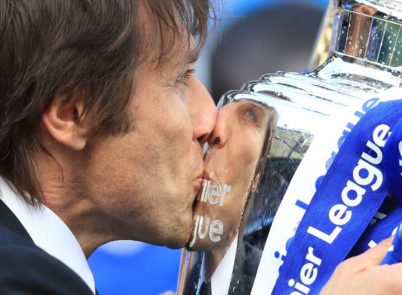 Antonio Conte kisses the Premier League trophy after the winning the title with Chelsea in 2017. PA