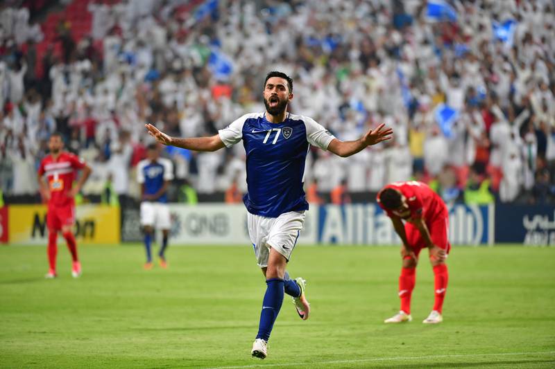 Al Hilal's forward Omar Khribin celebrates after scoring during the first leg of their AFC Champions League semi-final football match at the Mohammed Bin Zayed Stadium in Abu Dhabi on September 26, 2017.  / AFP PHOTO / GIUSEPPE CACACE