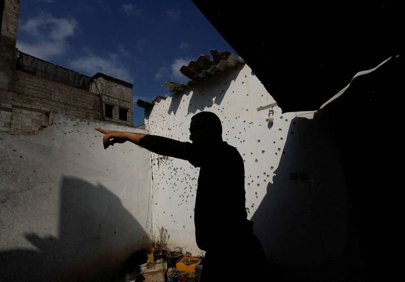 A Palestinian man inspects the ruins of a house in the northern Gaza Strip. Reuters