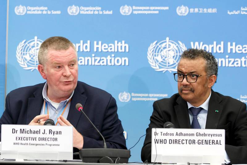 FILE - In this Monday, Feb. 24, 2020 file photo, Michael Ryan, left, Executive Director of WHO's Health Emergencies programme, next to Tedros Adhanom Ghebreyesus, right, Director General of the World Health Organization (WHO), addresses a press conference about the update on COVID-19 at the World Health Organization headquarters in Geneva, Switzerland. The emergencies chief of the World Health Organization said on Monday March 1, 2021, it was â€œprematureâ€ and â€œunrealisticâ€ to think the pandemic might be stopped by the end of the year, but that the recent arrival of effective vaccines could at least help dramatically reduce hospitalizations and death. (Salvatore Di Nolfi/Keystone via AP, File)