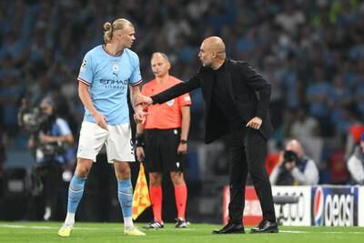 Manchester City's Erling Haaland speaks to manager Pep Guardiola in Istanbul. Getty