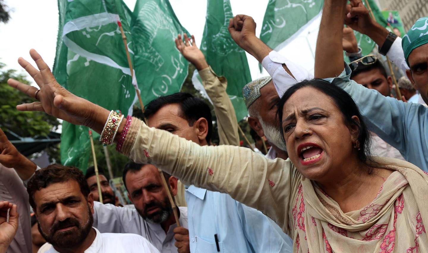 epa06915895 Supporters of Pakistan Muslim League Nawaz (PMLN) party which recently concluded its mandate shout slogans during a protest against alleged rigging in general elections, in Karachi, Pakistan, 28 July 2018. Pakistan's outgoing ruling party joined a dozen other parties on 27 July in announcing protests to demand a re-do of this week's general elections, rejecting preliminary results that point to victory for the party of retired cricket great Imran Khan.  EPA/REHAN KHAN