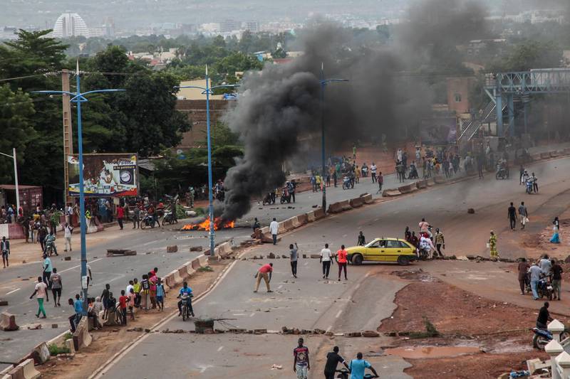 Anti-government protesters burn tires and barricade roads in the capital Bamako, Mali. AP Photo