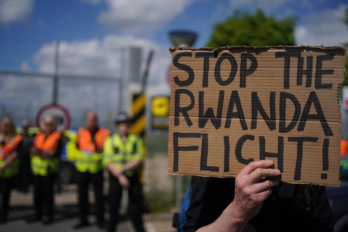 Demonstrators at a removal center in Gatwick protest against plans to send migrants to Rwanda.