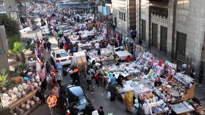 Egyptian street vendors in Cairo. Mr El Sisi ordered a $60 billion New Administrative Capital to be built in the desert east of Cairo. EPA