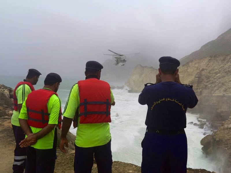 Omani rescue teams search for bodies after a family of three were washed from a rocky beach into the sea on Sunday, July 10. The bodies were later found. Photo: Oman News Agency