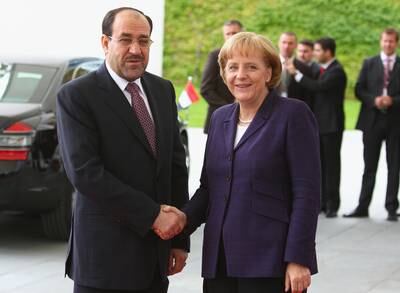 German Chancellor Angela Merkel shakes hands with prime minister Nouri Al Maliki upon arrival at the Chancellery in Berlin on July 22, 2008.