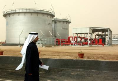 AQ Kuwaiti man walks by oil instalations in Ahmadi, Kuwait, Feb 3 , 2011.(Photo:Gustavo Ferrari/The National)