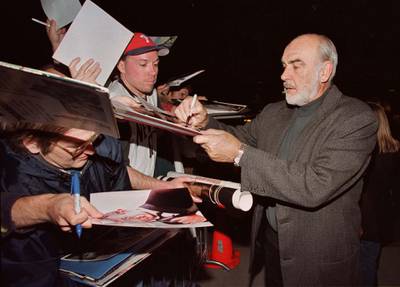 Actor Sean Connery, one of the stars of the film " Playing By Heart," signs autographs for fans at the film's premiere December 11 in Los Angeles. Connery and actress Gena Rowlands portray a couple in the film whose long and comfortable marriage is suddenly threatened by surprises from within and without.

FSP/SV/CLH/