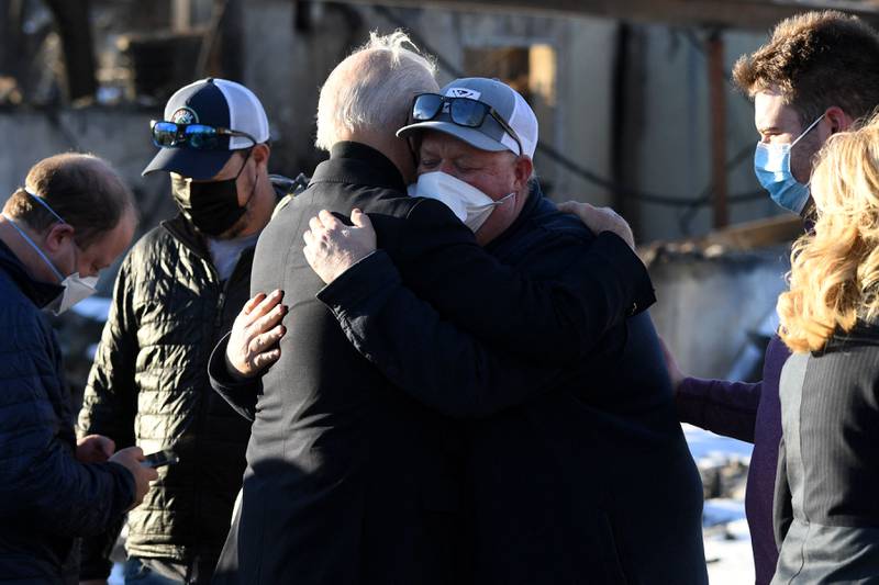 US President Joe Biden hugs a man as he and first lady Jill Biden greet local residents during a tour of a neighbourhood destroyed by the Marshall Fire in Louisville, Colorado. AFP