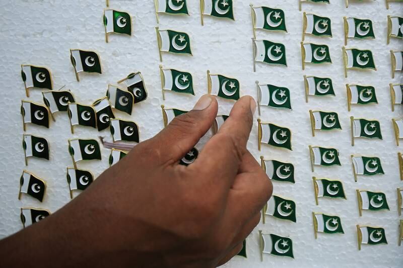 Pakistan flag pin badges for sale at a market in Peshawar. EPA