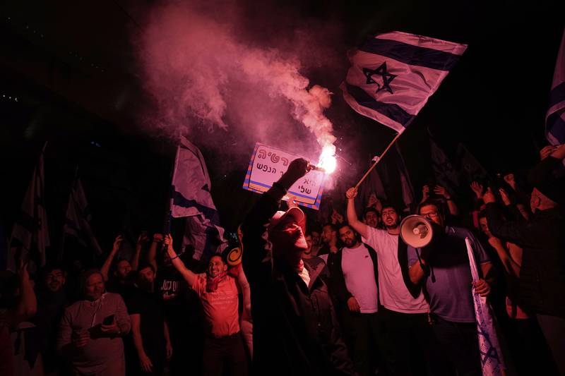 Israeli protesters block a road in Tel Aviv. AP