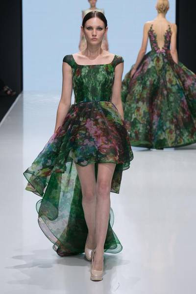 Emerald green gowns with abstract blooms and buds and floaty trains. Courtesy Michael Cinco and Couturissimo