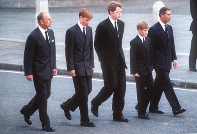 LONDON, ENGLAND - SPETEMBER 6:  (FILE PHOTO) Prince Philip, the Duke of Edinburgh, Prince William, Earl Spencer, Prince Harry and Prince Charles, the Prince of Wales follow the coffin of Diana, Princess of Wales this in September 6, 1997 file photo in London, England.  The funeral took place seven days after she was killed in an automobile accident in Paris. Members of the royal family walked in the procession behind the coffin, as did 500 representatives of the charities associated with the Princess.  At least a million people lined the streets of central London to watch the procession from Kensington Palace to Westminster Abbey.   (Photo by Anwar Hussein/Getty Images)