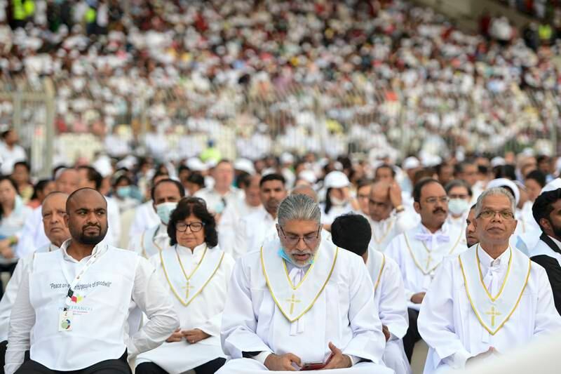 Eucharistic ministers will give holy communion for the early morning Papal mass. Khushnum Bhandari / The National

