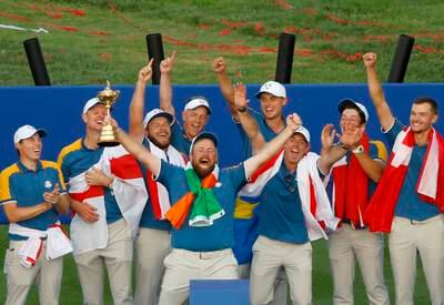 Shane Lowry of Team Europe lifts the Ryder Cup trophy following victory over Team USA. Getty