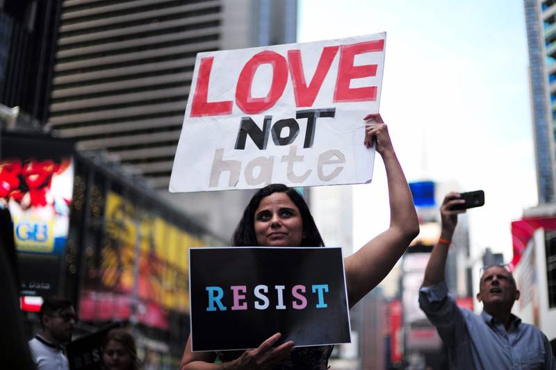(FILES) This file photo taken on July 26, 2017 shows protesters against US President Donald Trump during a demonstration in front of the US Army career center in Times Square, New York.
Trump on August 25, 2017, signed a memo effectively barring transgender people from joining the US military, but left the fate of those already serving up to the Pentagon. / AFP PHOTO / Jewel SAMAD