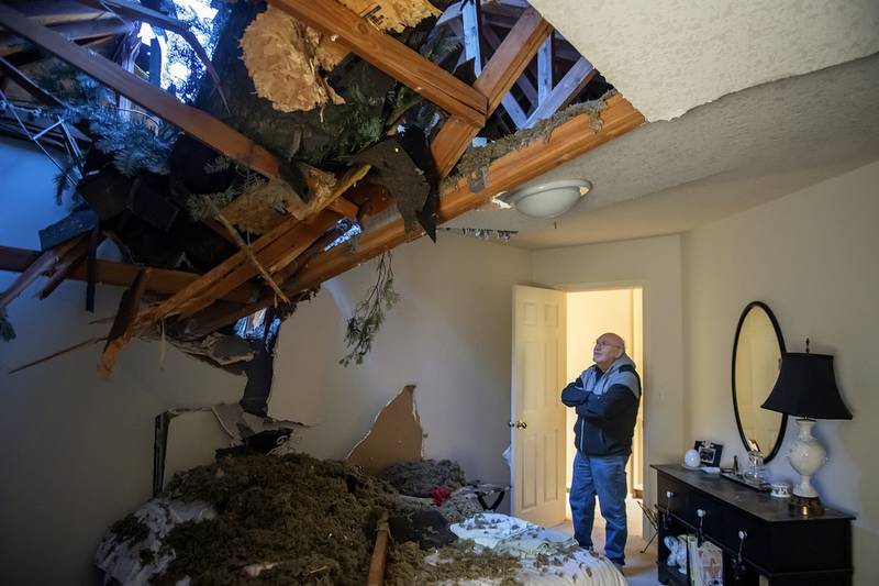Bill Drummond after high winds caused a tree to crash through two of his upstairs bedrooms in Hazel Dell, Washington. AP