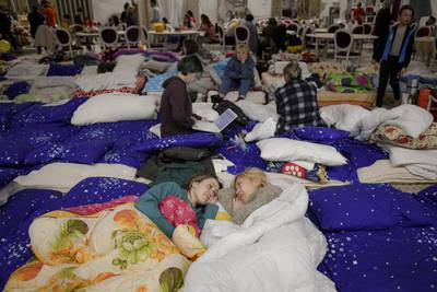 Refugees at a makeshift shelter set up at a four-star hotel in Suceava, Romania. AP