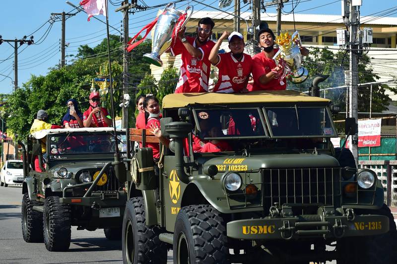 Thai fans of Liverpool Football Club take part in a parade in the southern province of Narathiwat as they celebrate the English Premier League club's title success on Monday, July 27, 2020. AFP