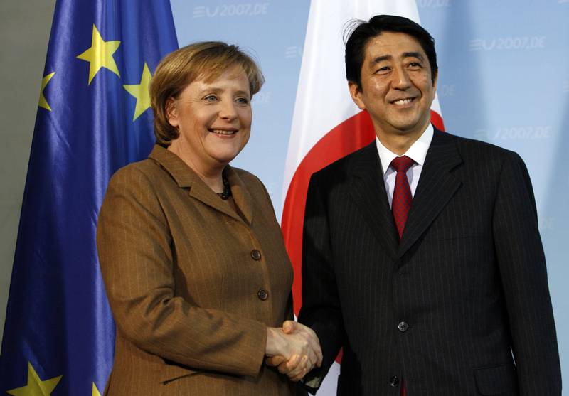 Angela Merkel, then Germany's chancellor, shakes hands with Mr Abe in Berlin in January 2007. Bloomberg