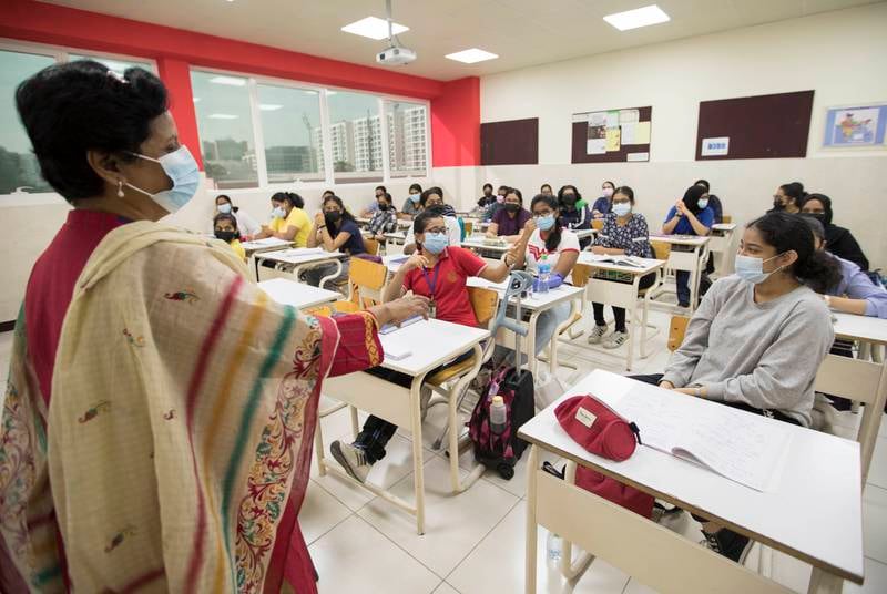 Pupils inside a classroom listen to their teacher on their first day of in-person learning at Indian High School in Oud Metha, Dubai. Ruel Pableo / The National