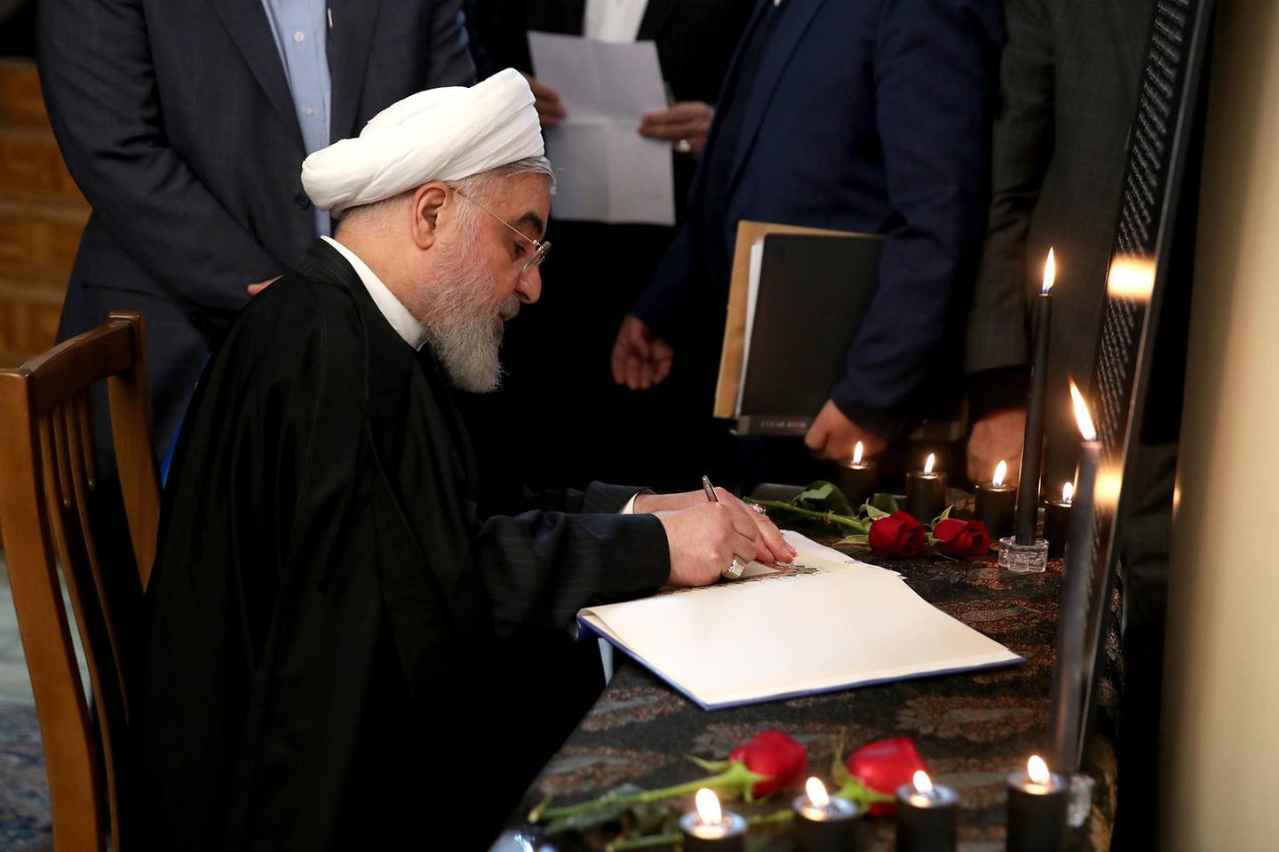 epa08129866 A handout photo made available by the Iranian Presidential Office shows Iranian President Hassan Rouhani signing a book carrying the names of the victims of the Ukraine International Airlines Flight 752 downing, after a cabinet meeting in Tehran, Iran, 15 January 2020. According to media reports, Rouhani said in a televised cabinet meeting that the accidental shooting down of a Ukrainian airliner on 08 January was an unforgivable error and that all those responsible will be punished.  EPA/IRANIAN PRESIDENTIAL OFFICE HANDOUT  HANDOUT EDITORIAL USE ONLY/NO SALES HANDOUT EDITORIAL USE ONLY/NO SALES