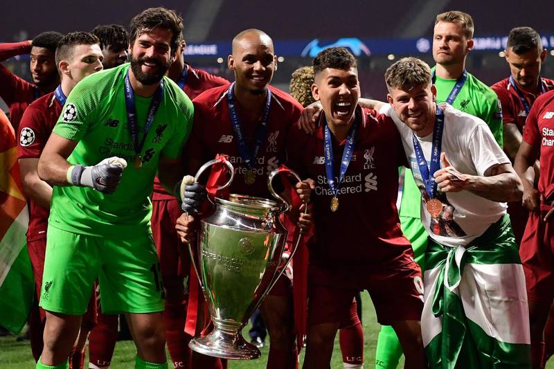 Alisson celebrates with his Liverpool teammates after their Champions League win. AFP