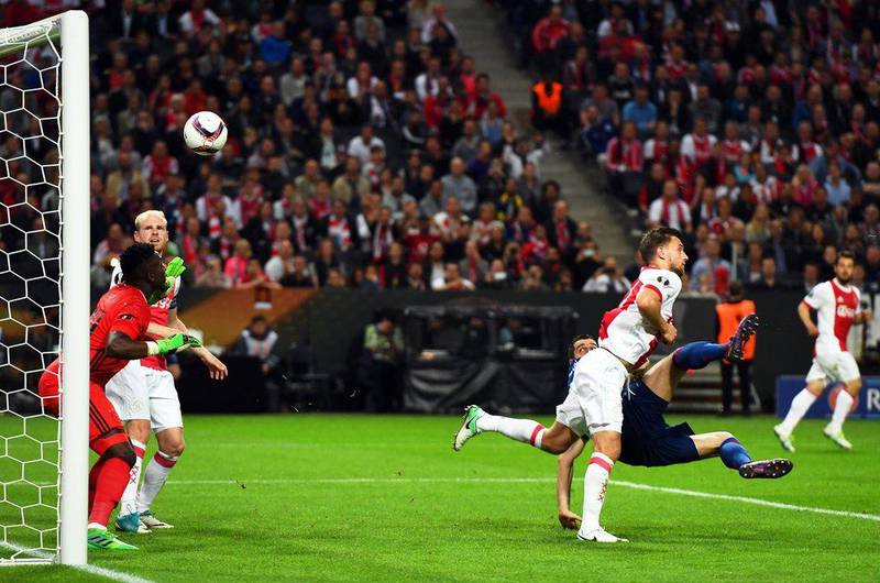 Manchester United midfielder Henrikh Mkhitaryan scores the second the final goal. Georgi Licovski / EPA