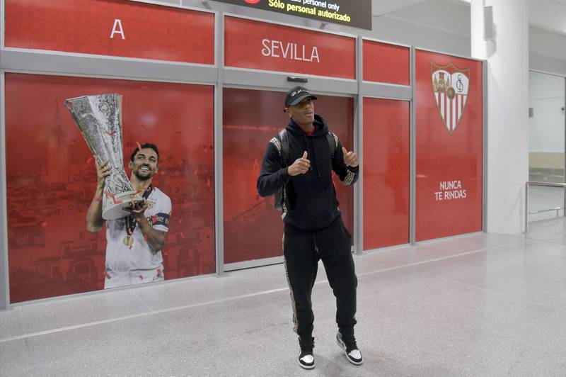 Anthony Martial, poses for photos at the airport upon his arrival in Seville. AFP