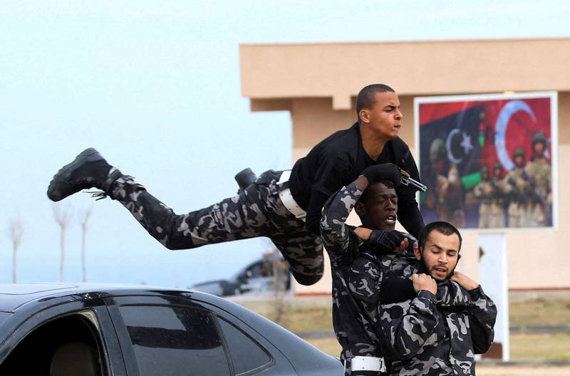 Recruits demonstrate their skills during an Interior Ministry passing-out ceremony in Tripoli, Libya. All photos: Reuters