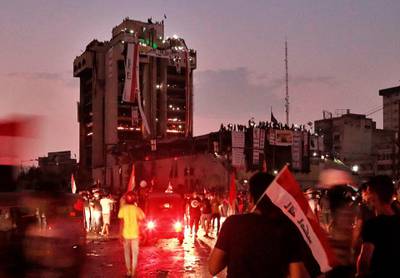 Anti-government protesters gather during a demonstration at sunset in Baghdad, Iraq. AP Photo