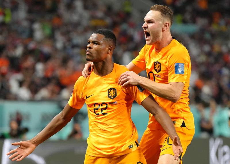 Denzel Dumfries celebrates with Teun Koopmeiners after scoring the Netherlands' third goal in the 3-1 Round of 16 win against USA at the Khalifa International Stadium in Al Rayyan on December 3, 2022. PA