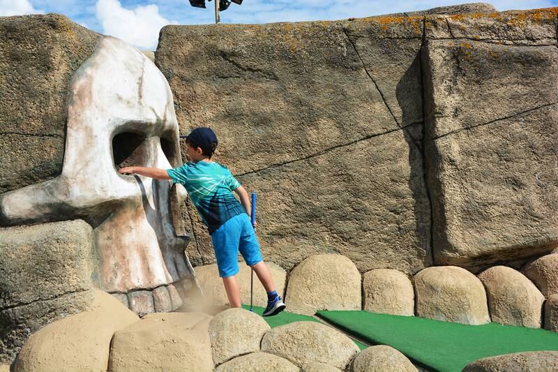 Eyes on the ball at Hastings Adventure Golf. Photo: Hastings Adventure Golf